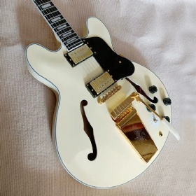 Hollow body jazz electric guitar in cream white color