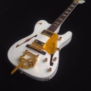 White Electrir Guitar and Gold Jazz Bridge